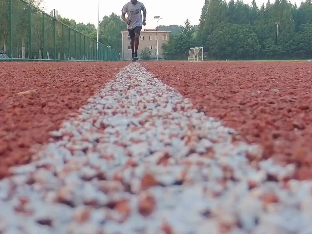 The lanes of a running track at dawn