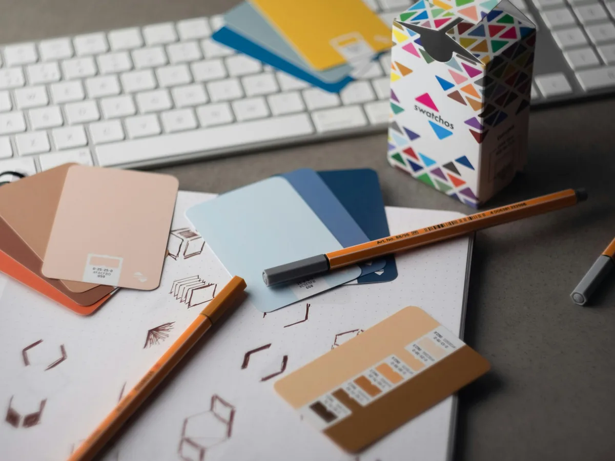 Colour swatches, pencils and paper on a designer’s desk