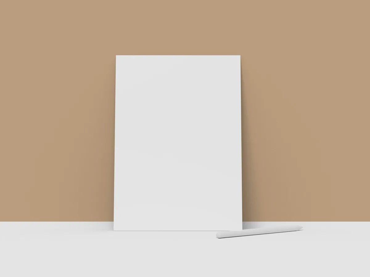 A blank white board leaning against a beige wall