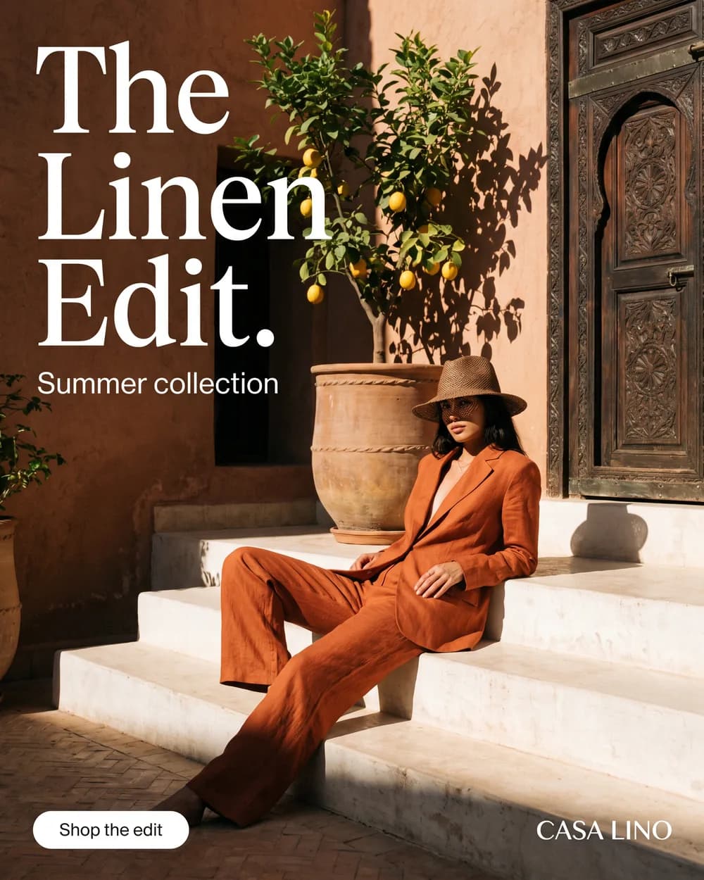 A linen fashion ad that reads The Linen Edit., a woman in a rust suit on whitewashed riad steps
