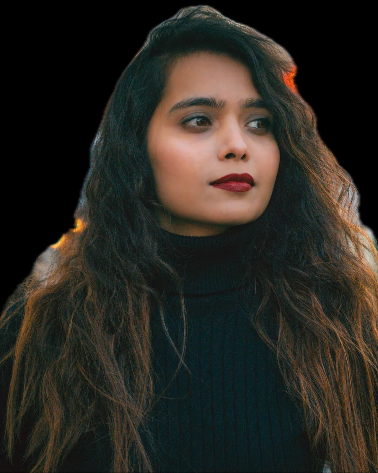 A woman with long hair on a city street at night, background removed