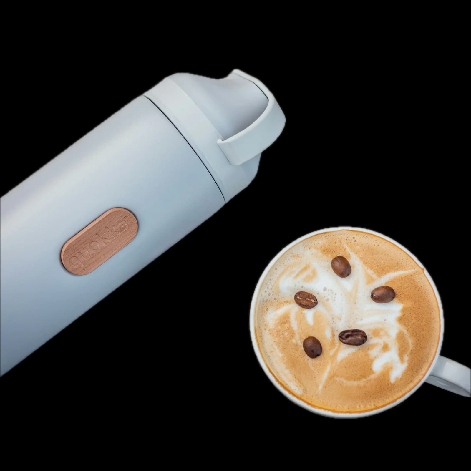 A thermos and a latte on a wooden table, background removed