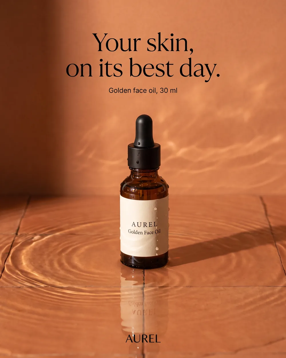 The ad rebuilt for AUREL, the bottle standing in still water on terracotta