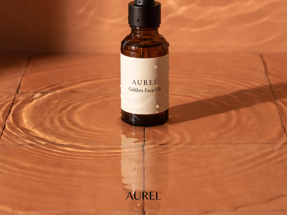 The AUREL wordmark under the bottle standing in water
