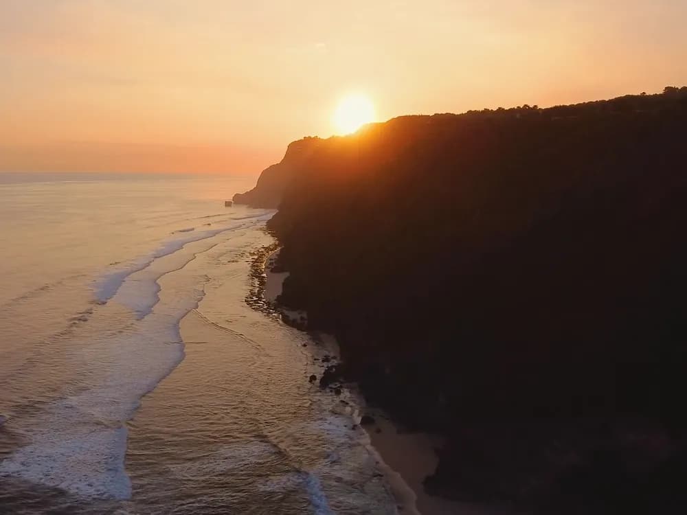 A coastline at sunset from above
