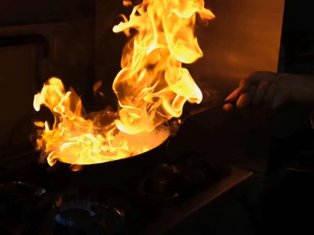 Flames rising from a pan