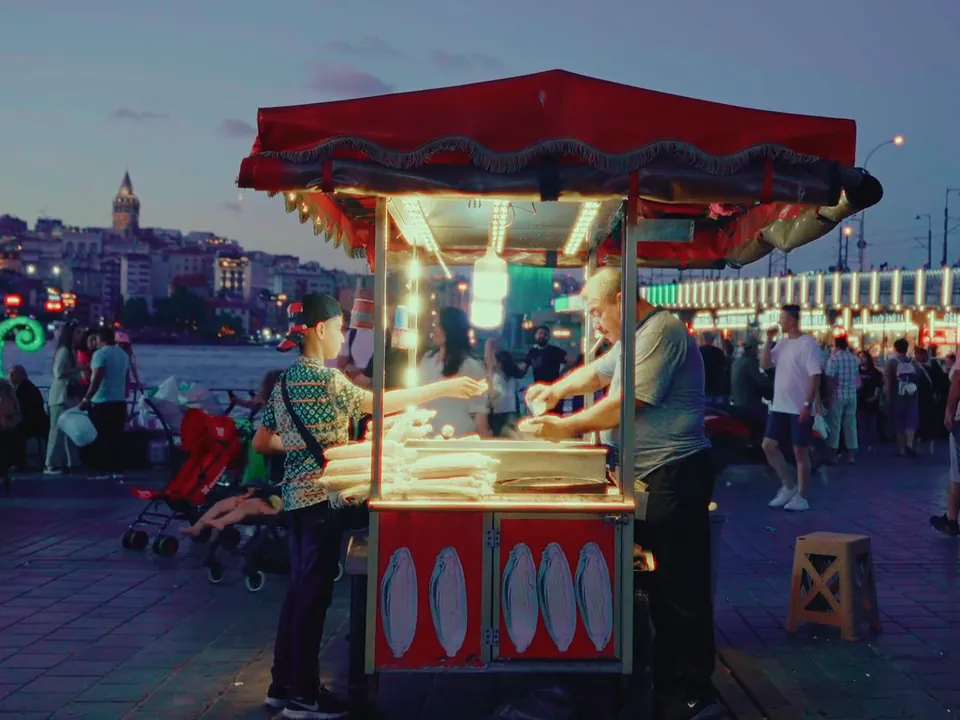 A street food cart at dusk