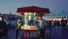 A street food cart at dusk, low resolution