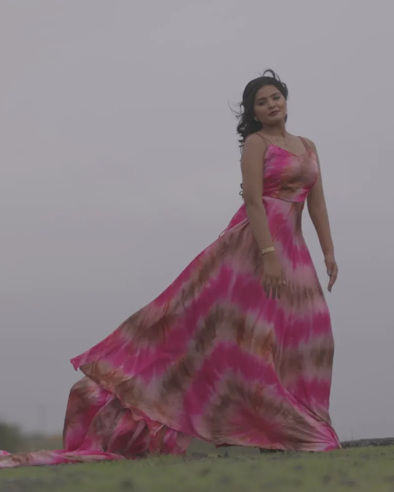 The same woman standing in the dress
