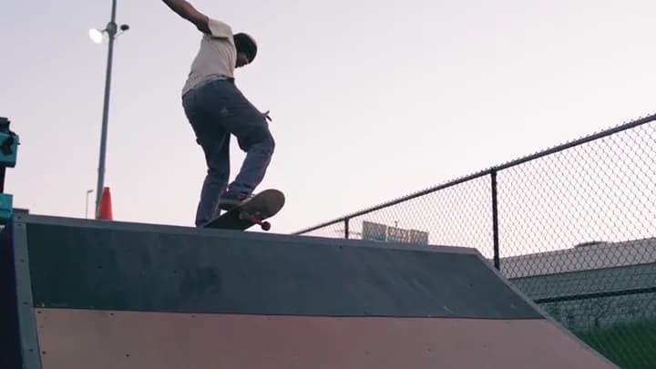 The skater grinding a ledge
