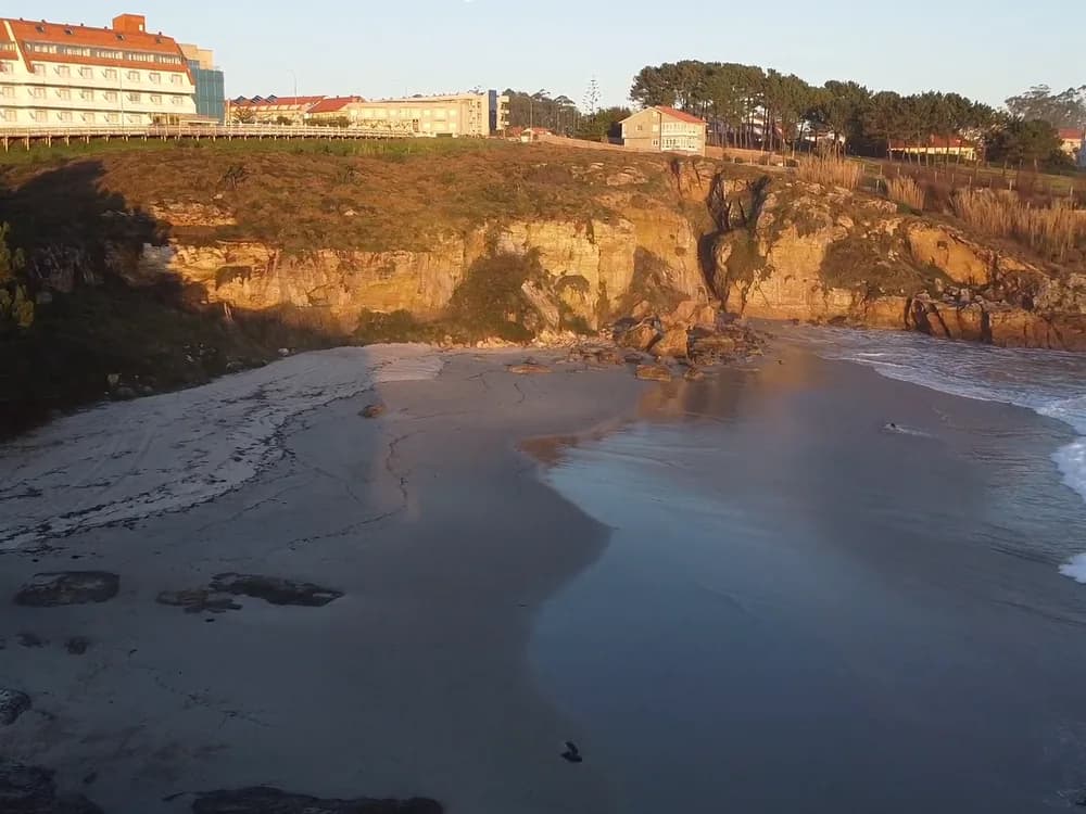 Golden cliffs above a beach at low tide
