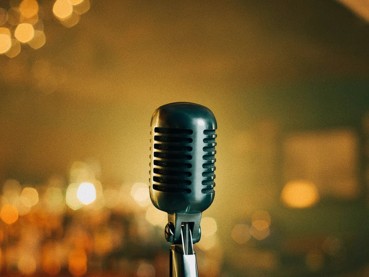 A vintage microphone in a warmly lit bar